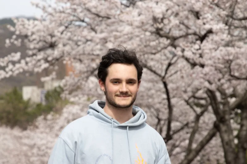 Nathan Lemale portrait with cherry blossoms